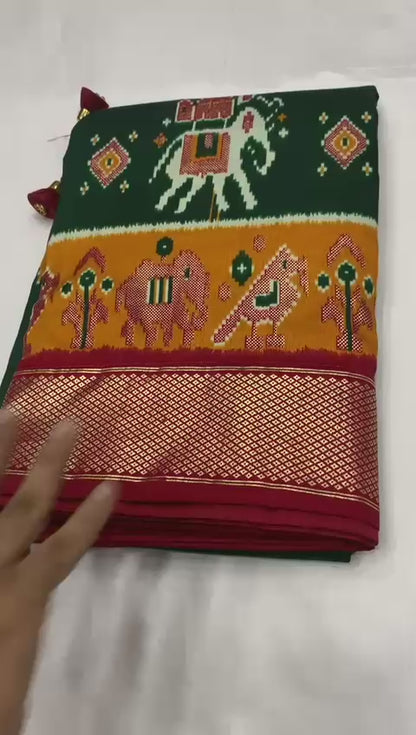 Dark green munga crepe patola silk sarees