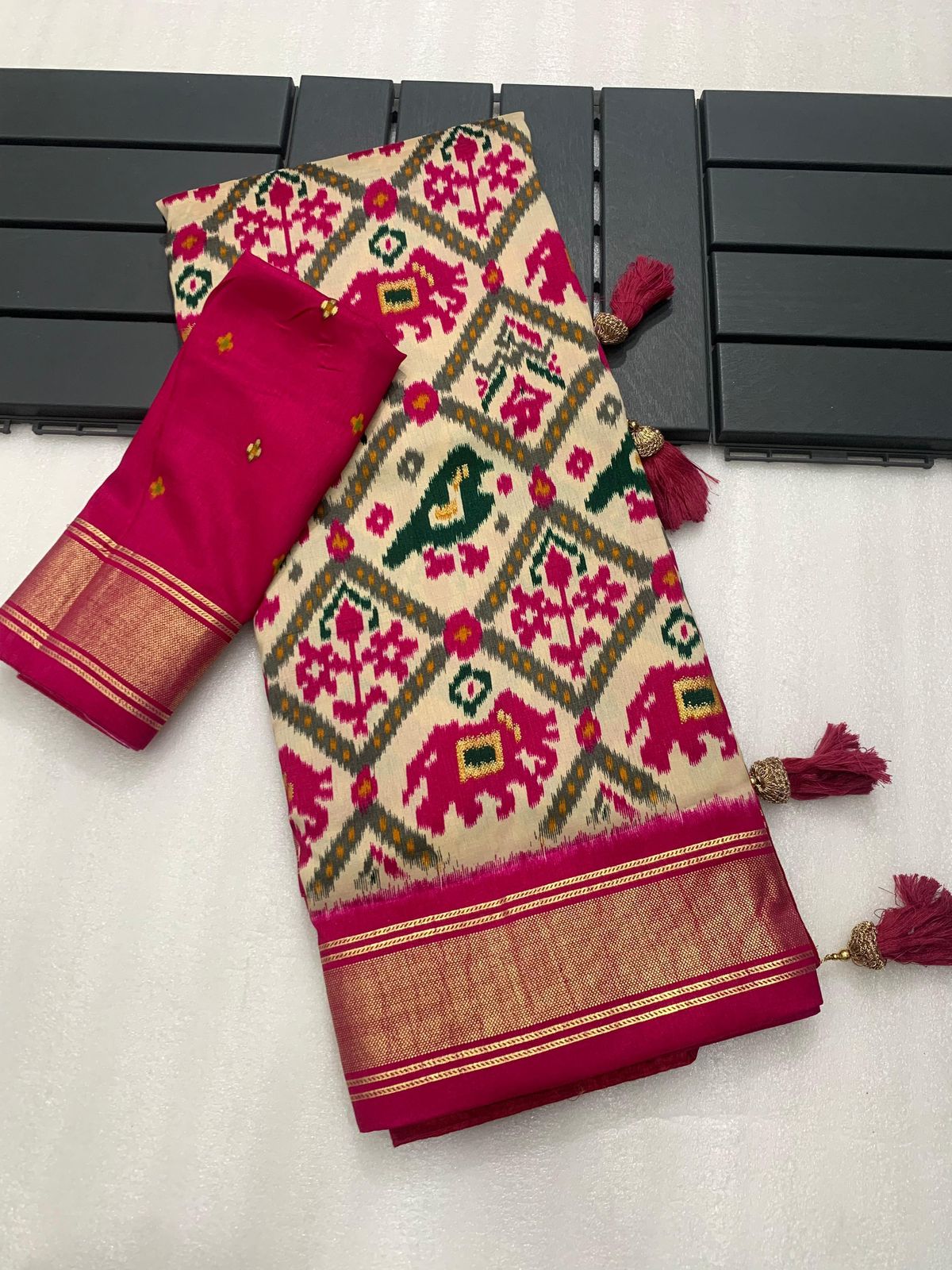 Cream with pink munga crepe patola silk sarees